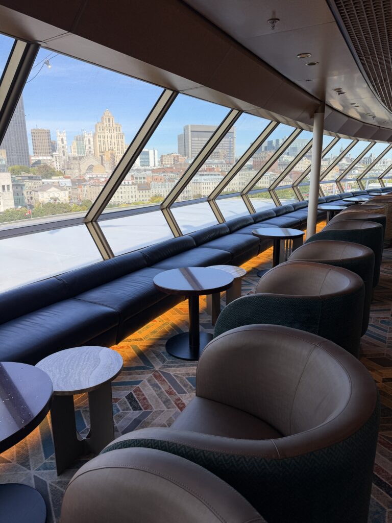 Crow’s Nest lounge aboard Holland America Volendam overlooking Montreal through panoramic windows