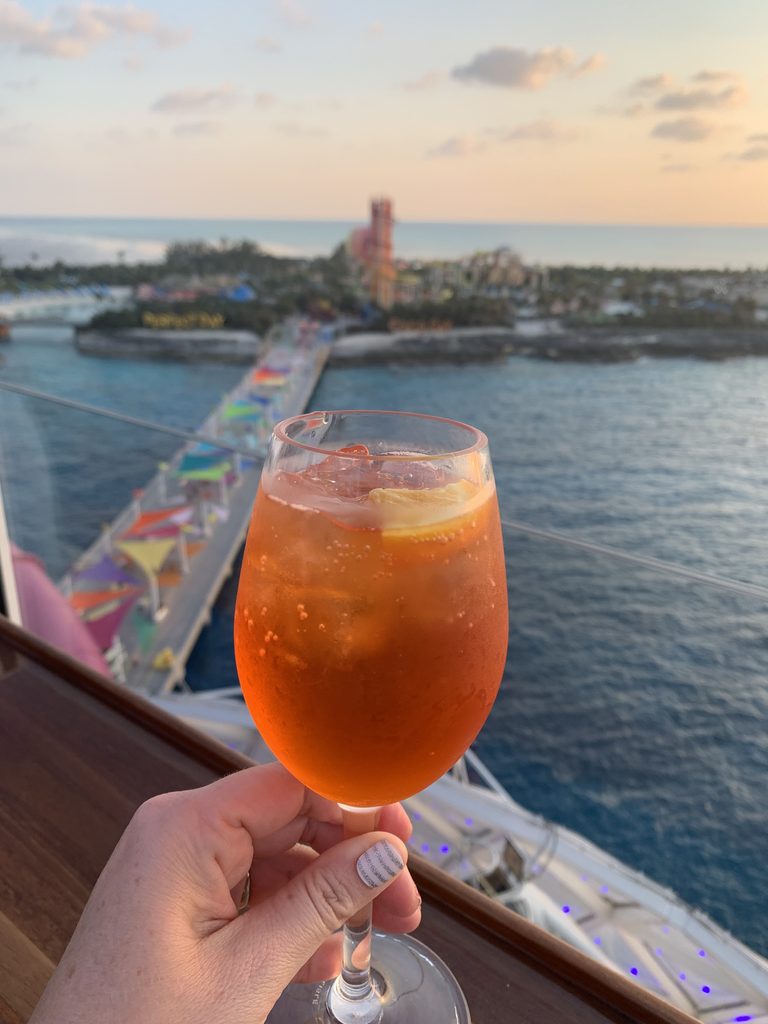 Drink on a balcony overlooking Perfect Day CocoCay, Bahamas