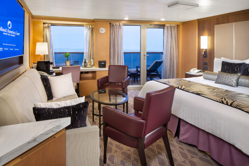 Neptune Suite interior with sitting area and private verandah aboard Zuiderdam