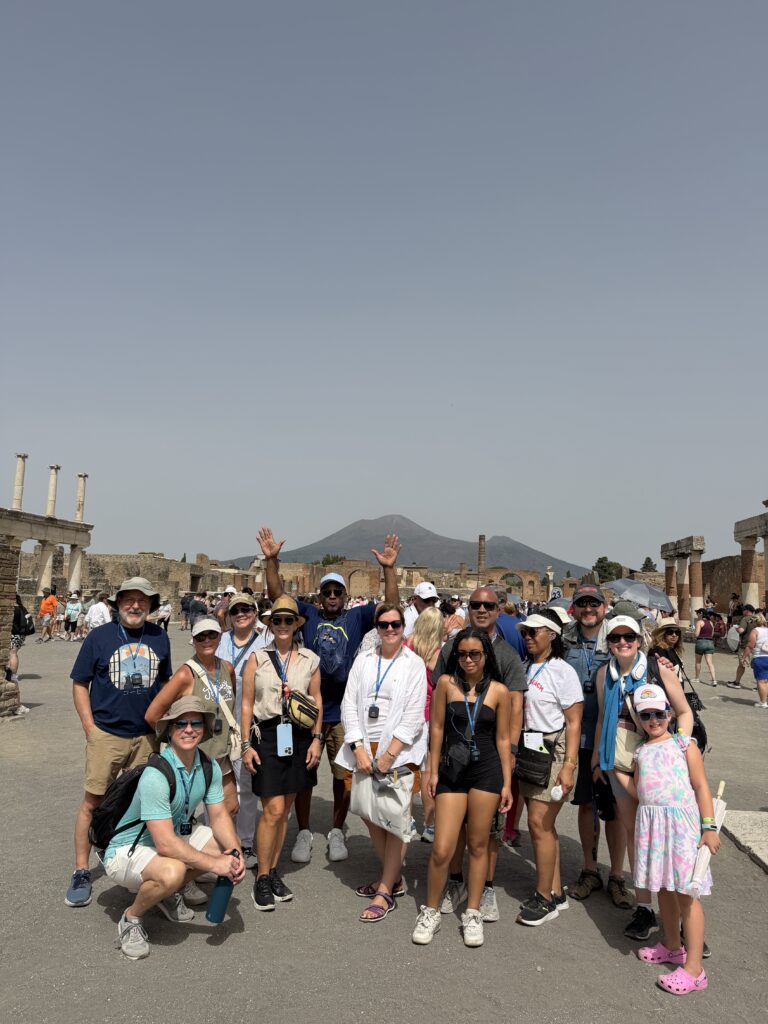 Distinctive Voyages group during an Exclusive Shore Event in Pompeii with Mount Vesuvius in the background