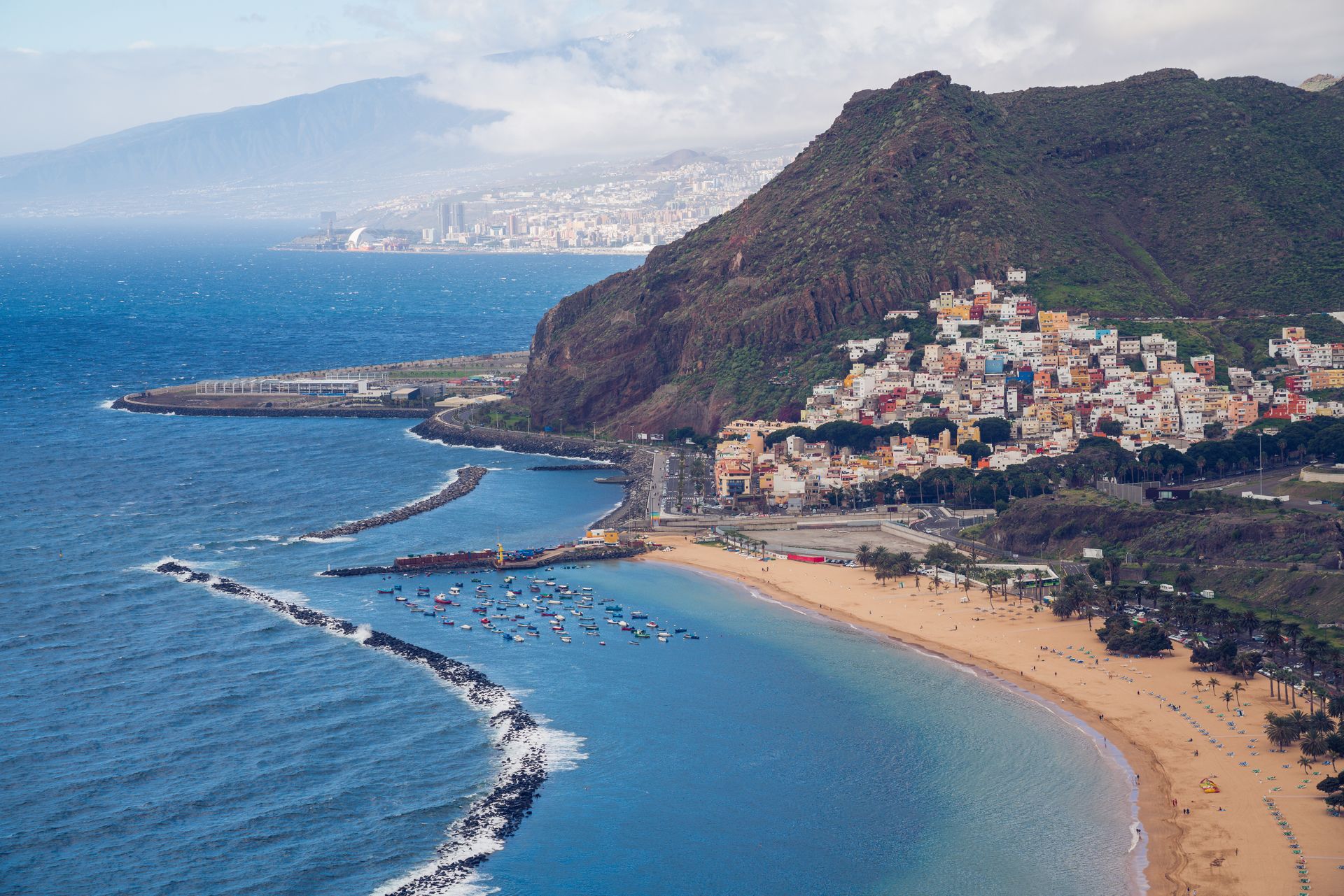 Coastal view of San Andrés and Las Teresitas Beach in Tenerife, Canary Islands, with colourful hillside homes and dramatic mountains