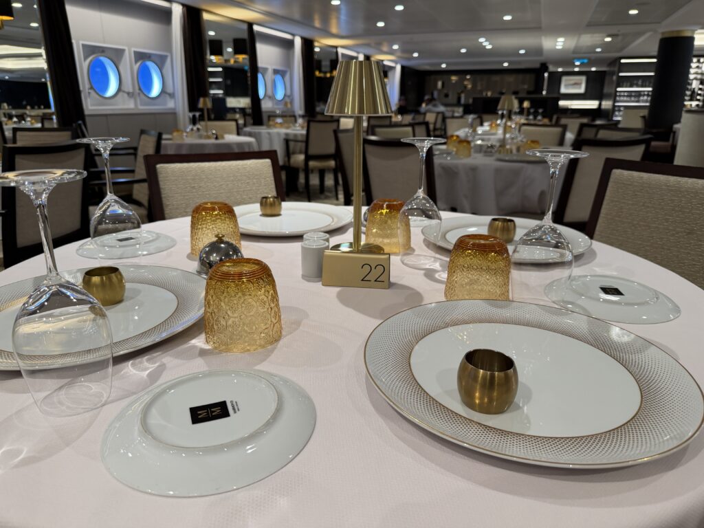 restaurant dining table set with gold accents
